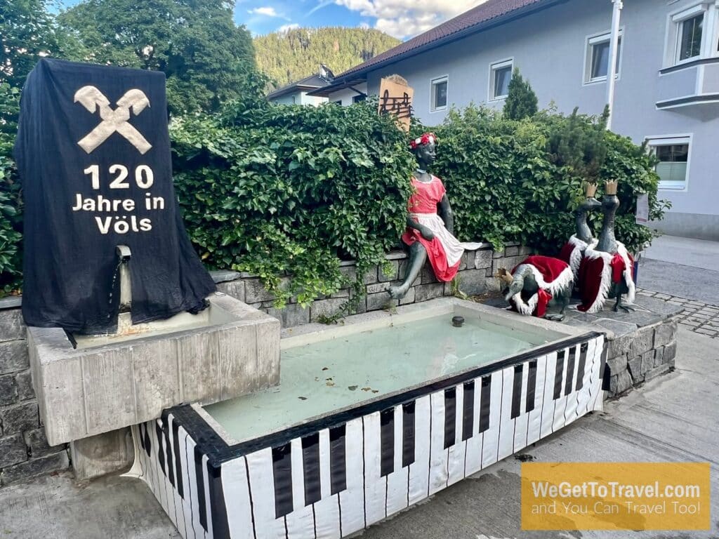 Statues, pool and signs in Völs Austria.