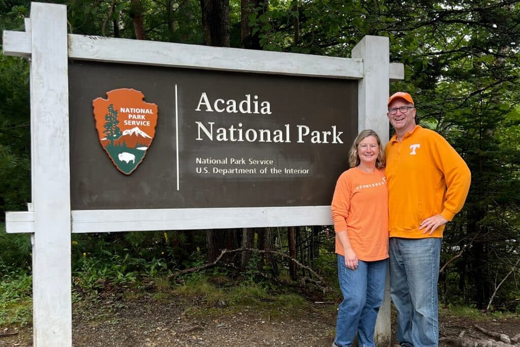 Ross and Zuzu with the Acadia National Park sign
