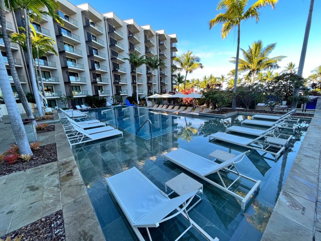white lounge chairs in the adult pool at andaz maui