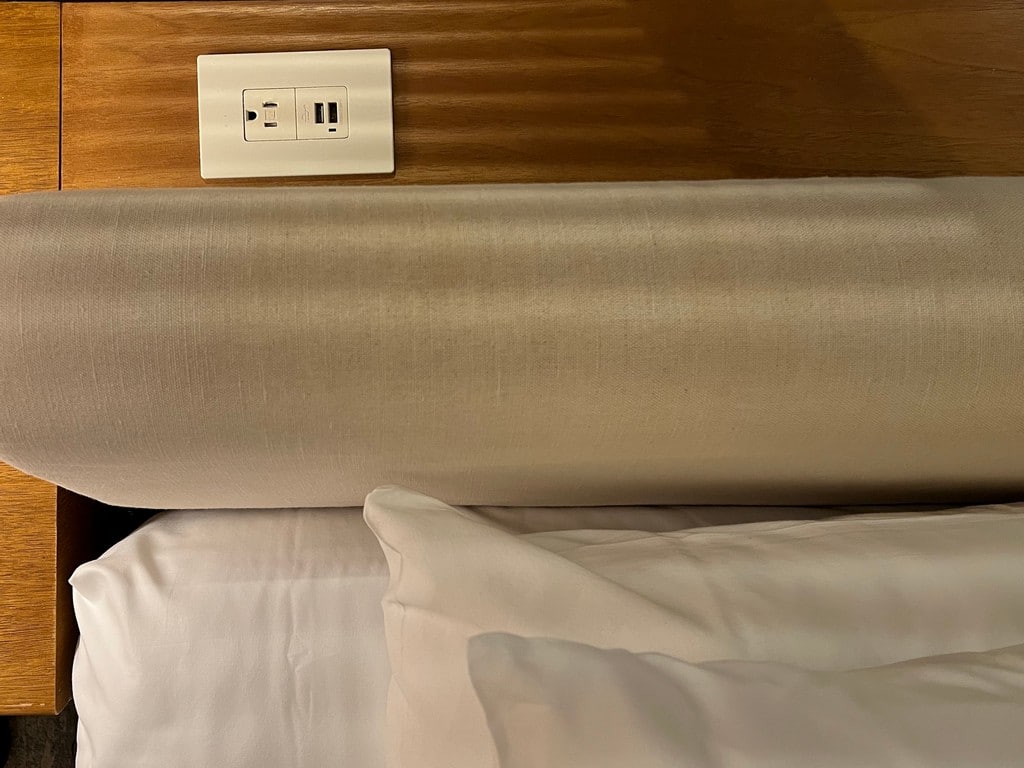 Looking down on the outlet & USB plugs above the headboard.