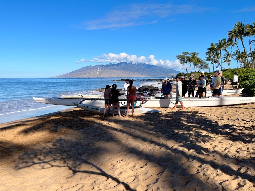 Andaz Maui guests getting ready to board canoe on Mokapu beach