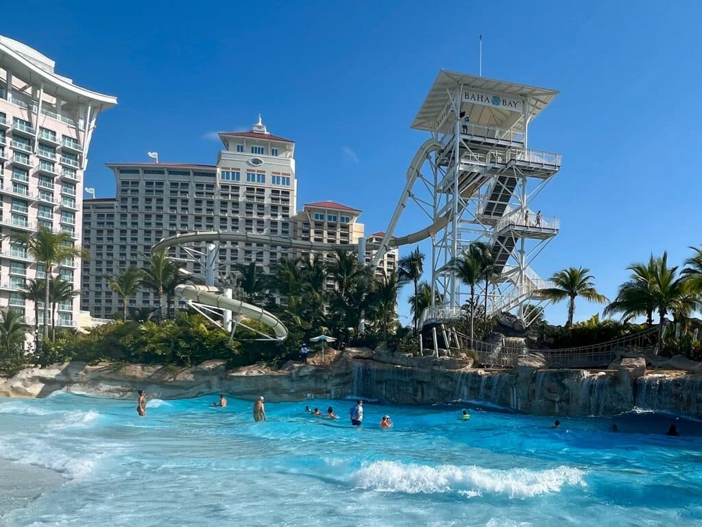 Wave pool and slide at Baha Bay water park with Grand Hyatt Baha Mar in the background.