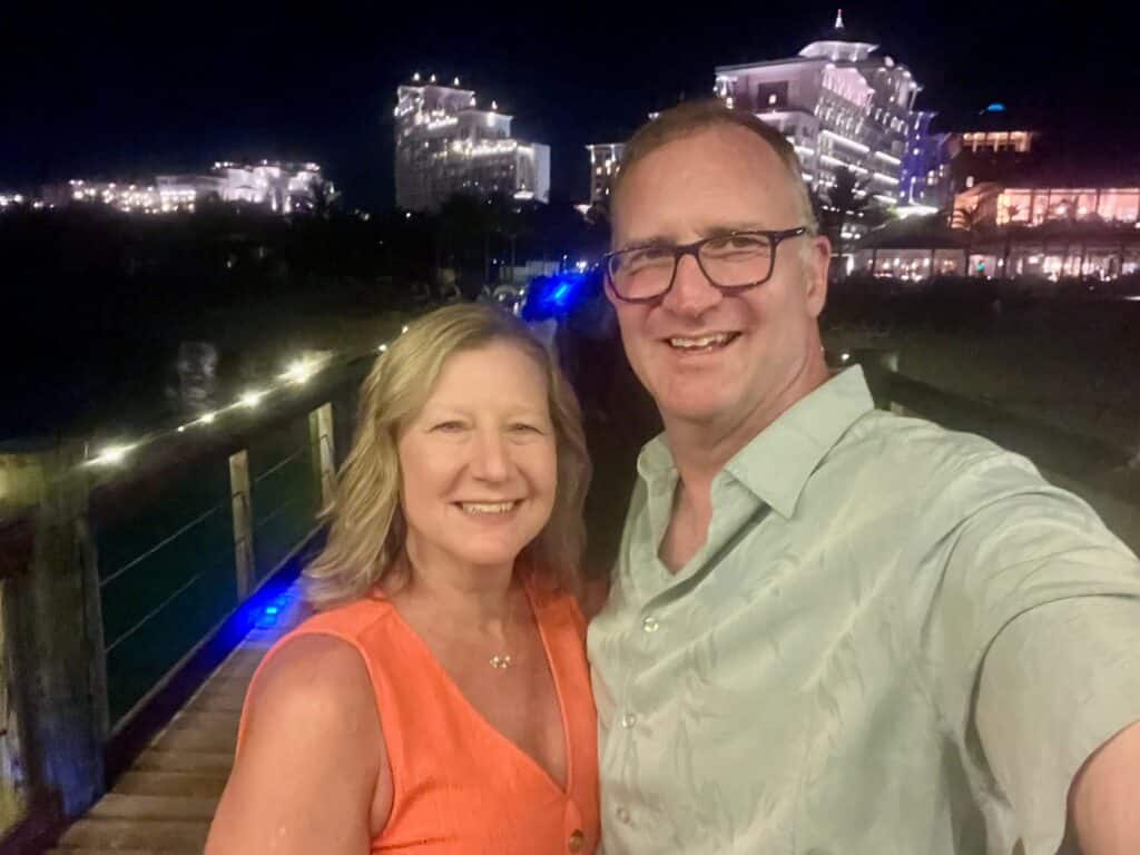Night picture of Ross and Zuzu on Cable Beach Pier with Grand Hyatt Baha Mar in the background