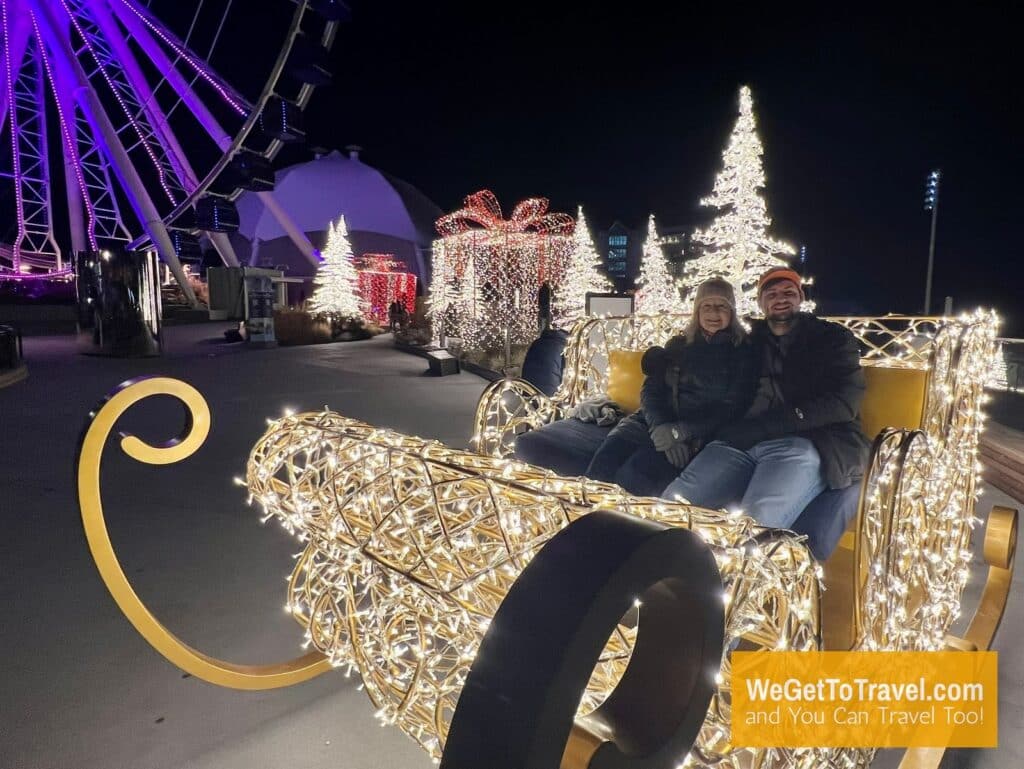 Zuzu and Trent on a lighted sleigh at Navy Pier in Chicago