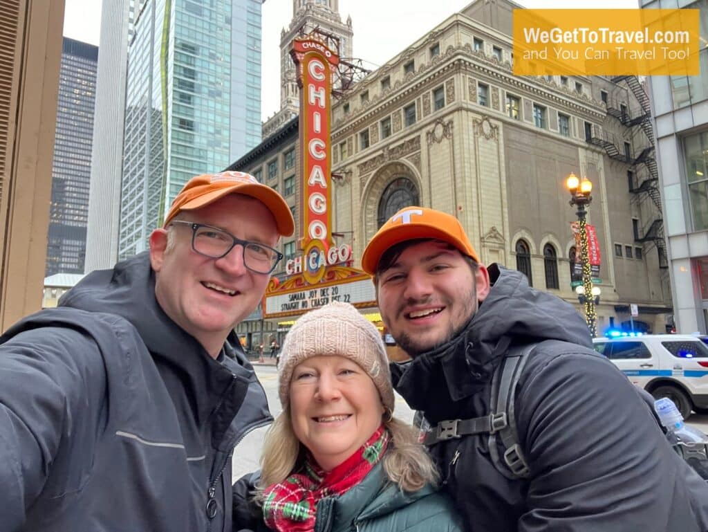 Ross Sandra and Trent pose in front of the iconic Chicago Theater sign