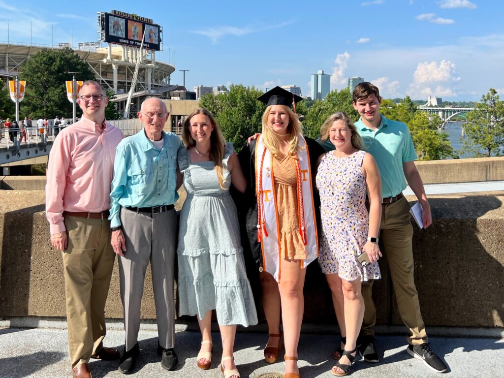 Jones family in front of the TN River and Neyland stadium after UT graduation.