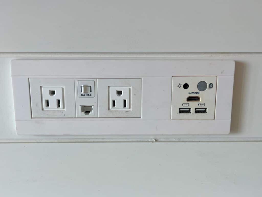 White outlets for electricity, USB A and HDMI connections