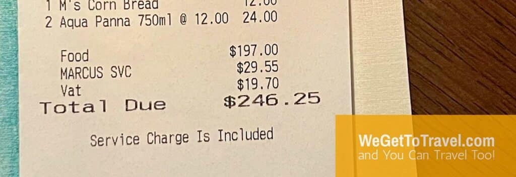 Receipt showing mandatory 15% gratuity and 10% tax added to food cost at Baha Mar restaurant.
