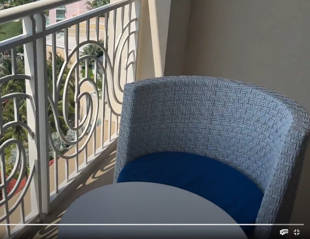 Very uncomfortable white wicker chair on our ocean view balcony