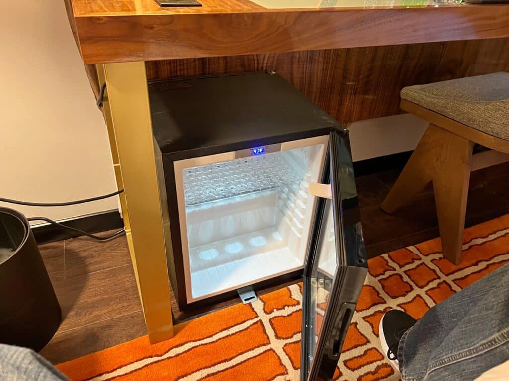 Picture of the Mini refrigerator placed under our desk which was delivered promptly.