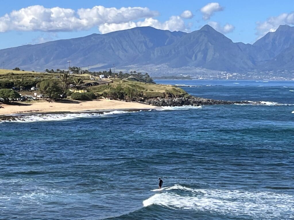 surfer at Ho'okipa Beach in Maui, Hawaii