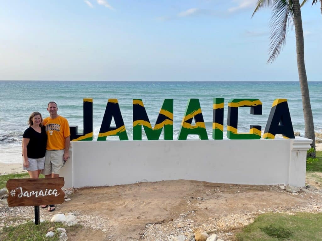 Ross & Zuzu with hashtag Jamaica sign at Hyatt Ziva Rose Hall All Inclusive Resort in Montego Bay.