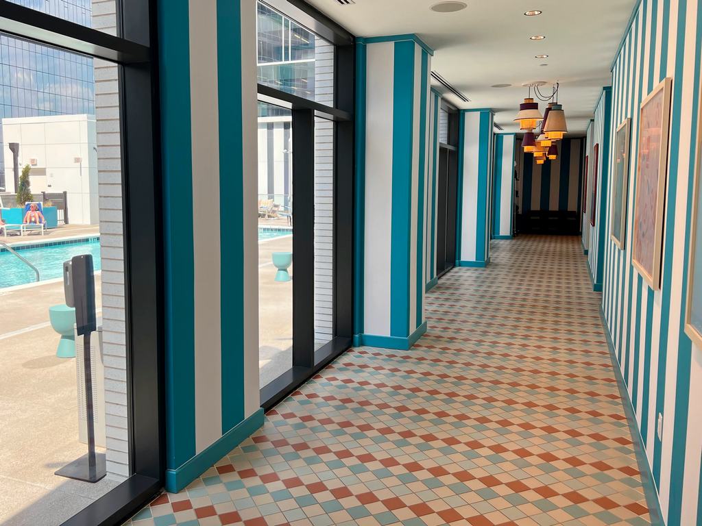 Blue and white hallway to pool and fitness center at Hyatt Centric Nashville.