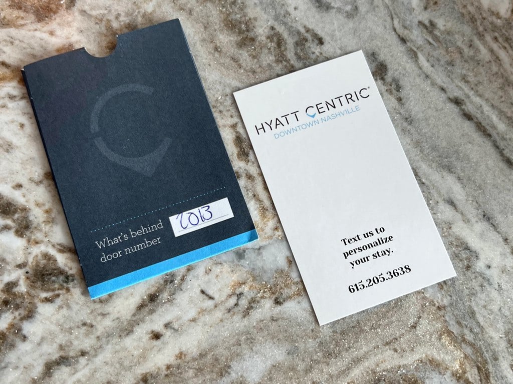 Room key sleeve and card with phone number to text service requests to at Hyatt Centric Downtown Nashville