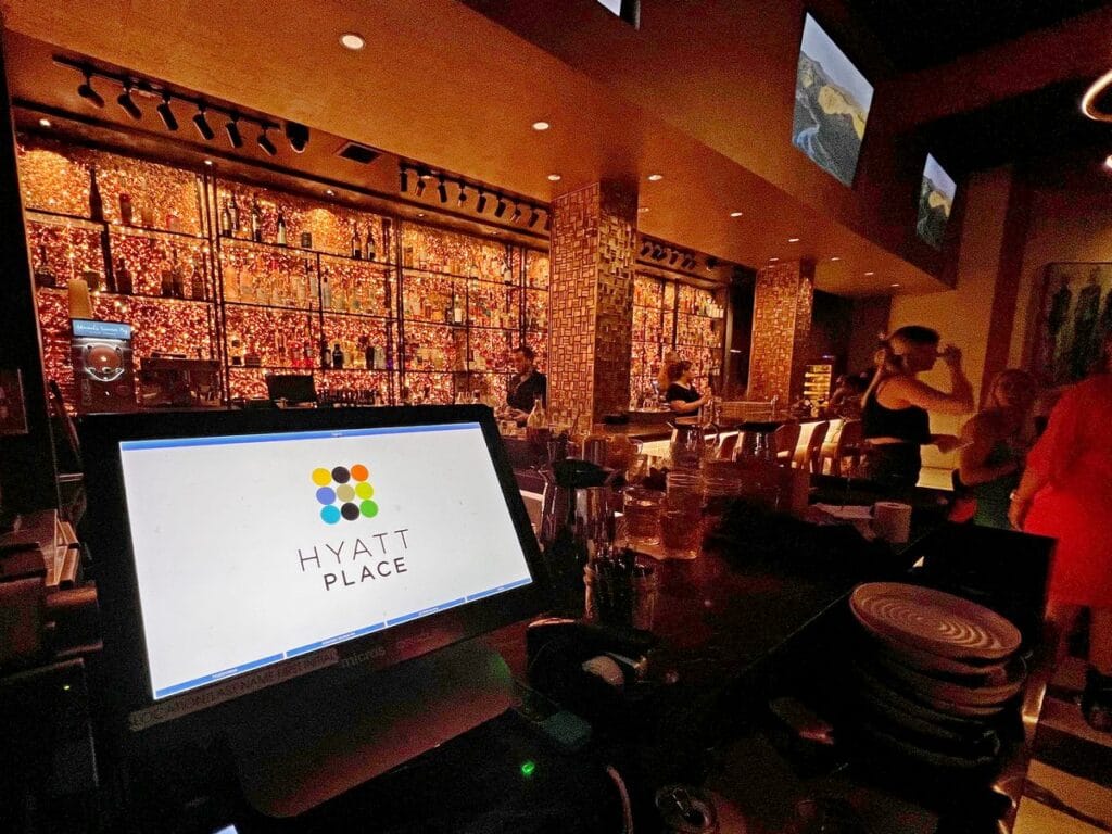 Hyatt Place logo on POS terminal in front of beautiful Five Thirty Lounge bar in Knoxville