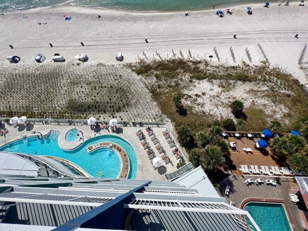 View of the pool, lazy river & beach from our room.
