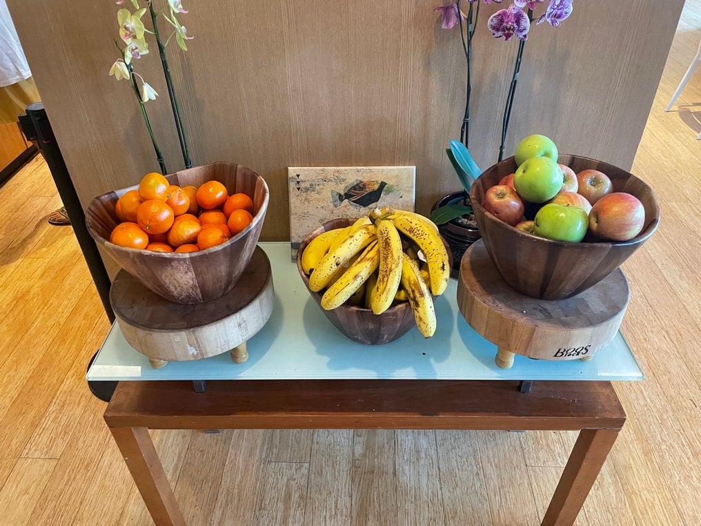 Oranges bananas and apples in wooden bowls