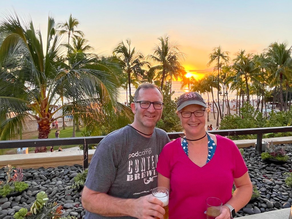Ross and Sandra at Waikiki Beach with sunset in the background