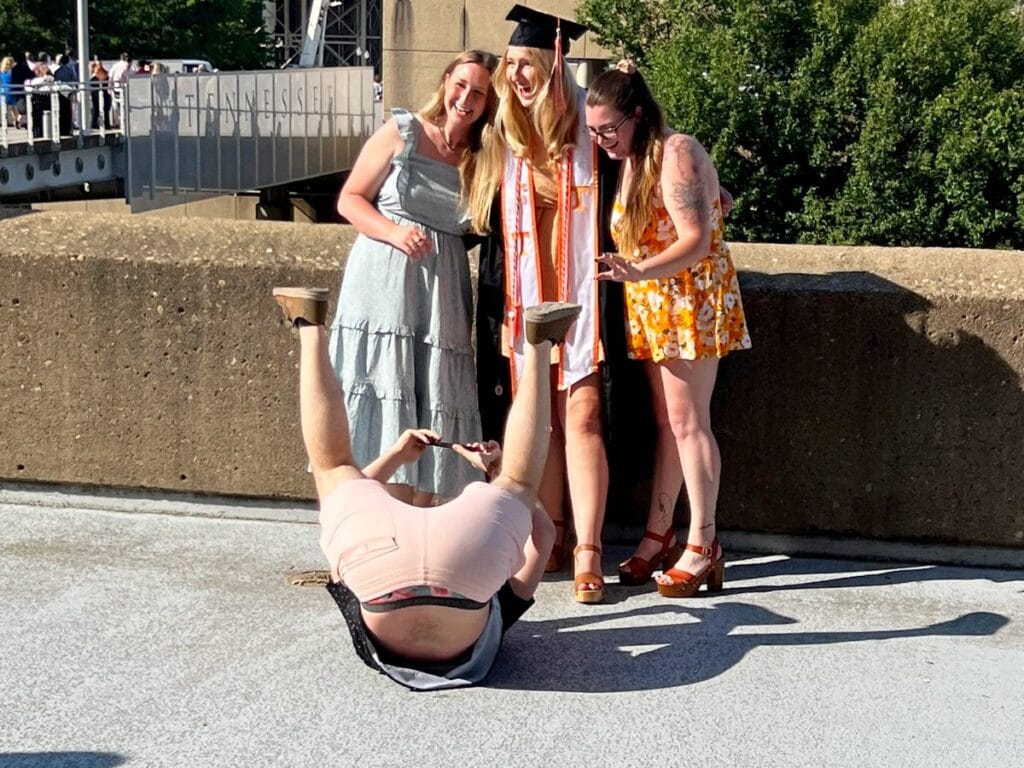 Jordan on his back to take a picture of the UT graduate from the perfect angle.