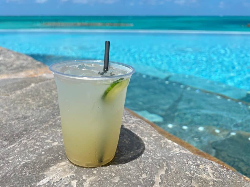 Margarite on the edge of infinity pool in Nassau, Bahamas