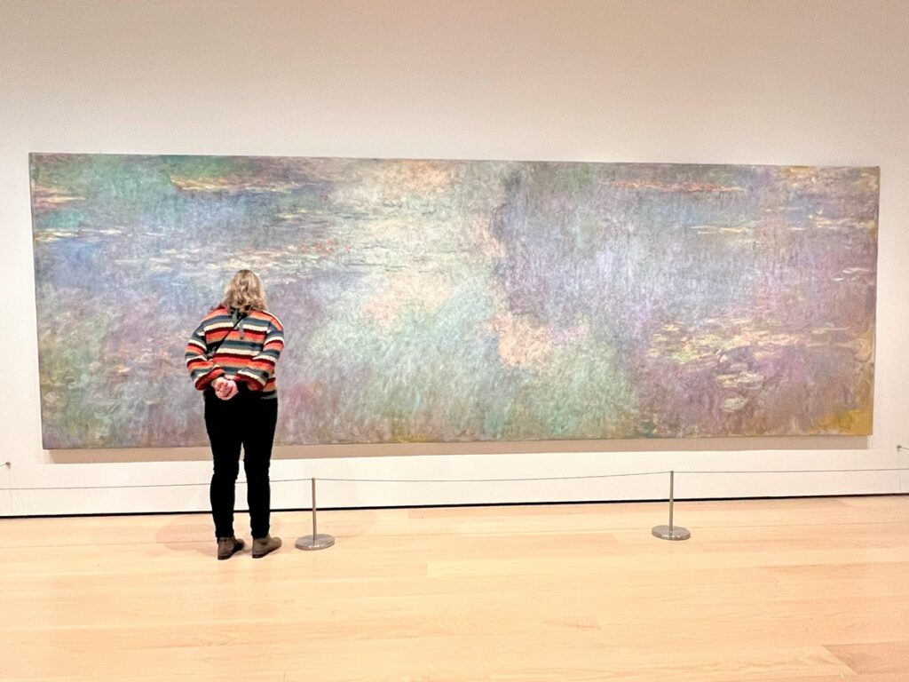 Zuzu looking at Monet Water Lilies exhibit @ MOMA Museum of Modern Art in NYC