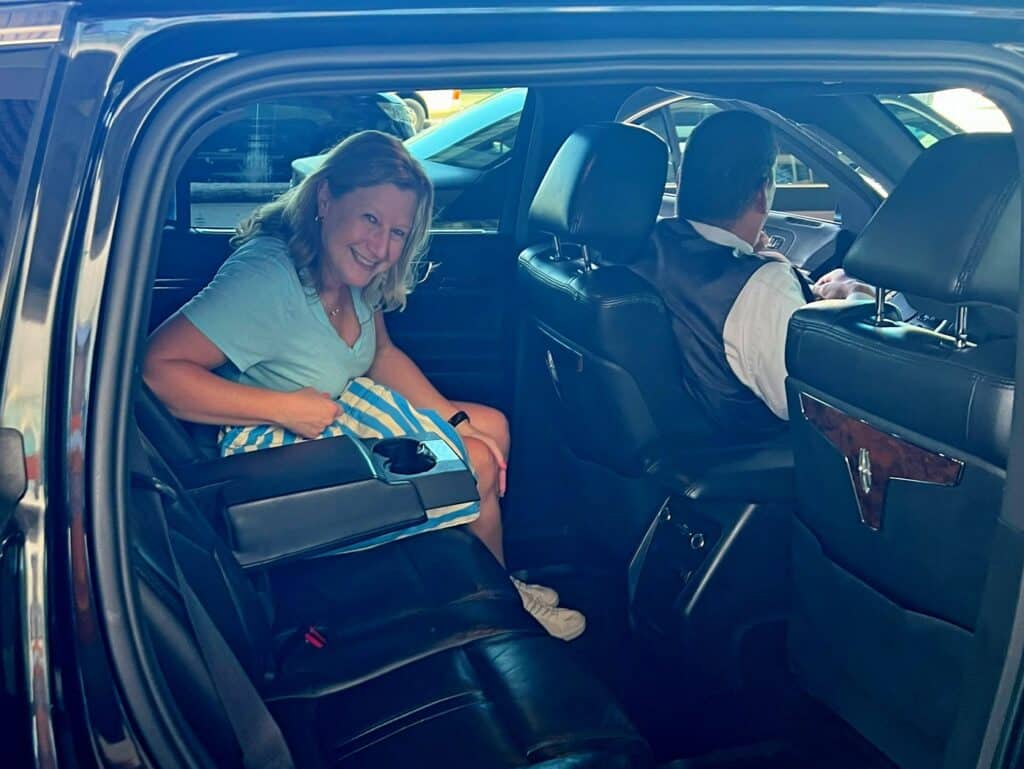 Zuzu getting the back of a limo at the Nassau Airport