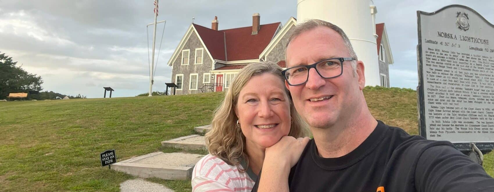 Ross and Zuzu in front of Lighthouse on our New England Roadtrip in Fall 2023