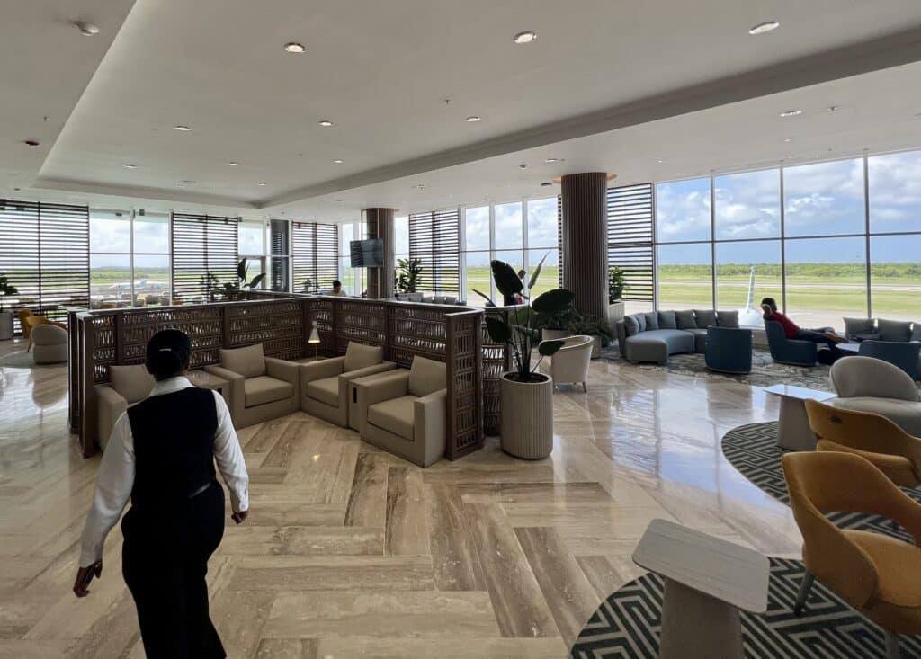 New Punta Cana Airport Lounge with staff and runway in background