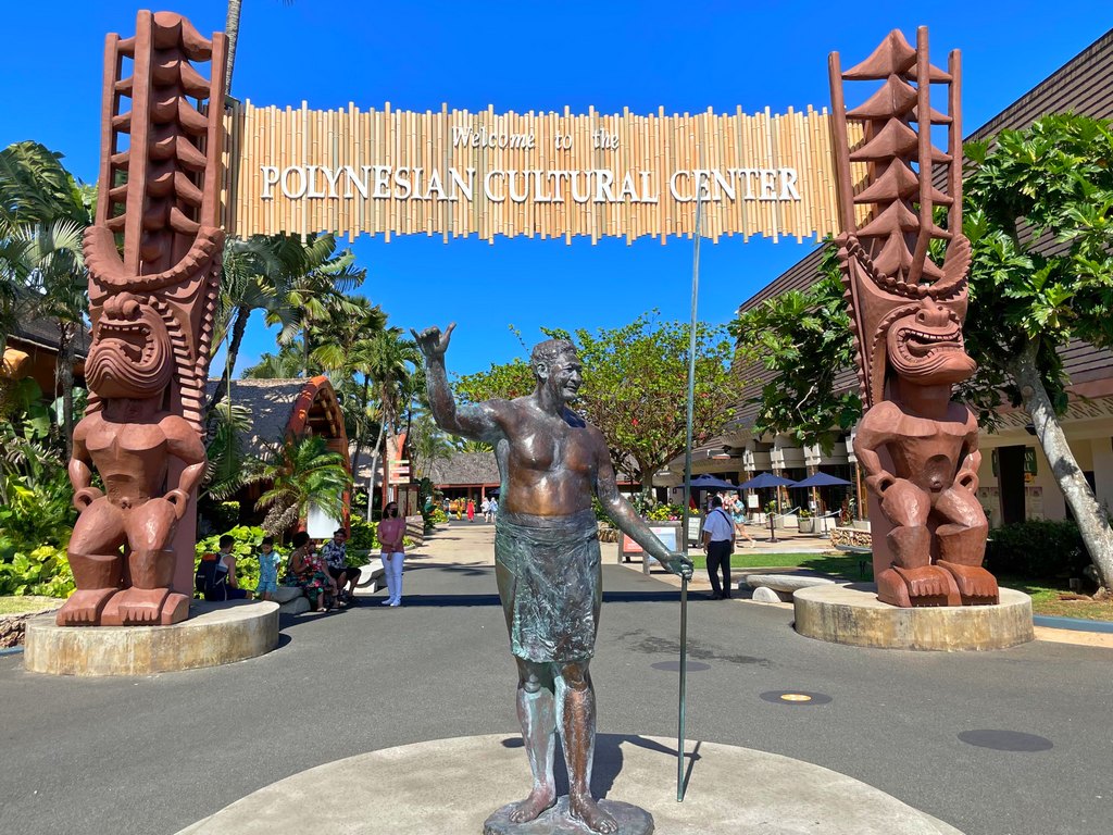 Statue and sign at the Entrance to the Polynesian Cultural Center on Oahu in Hawaii