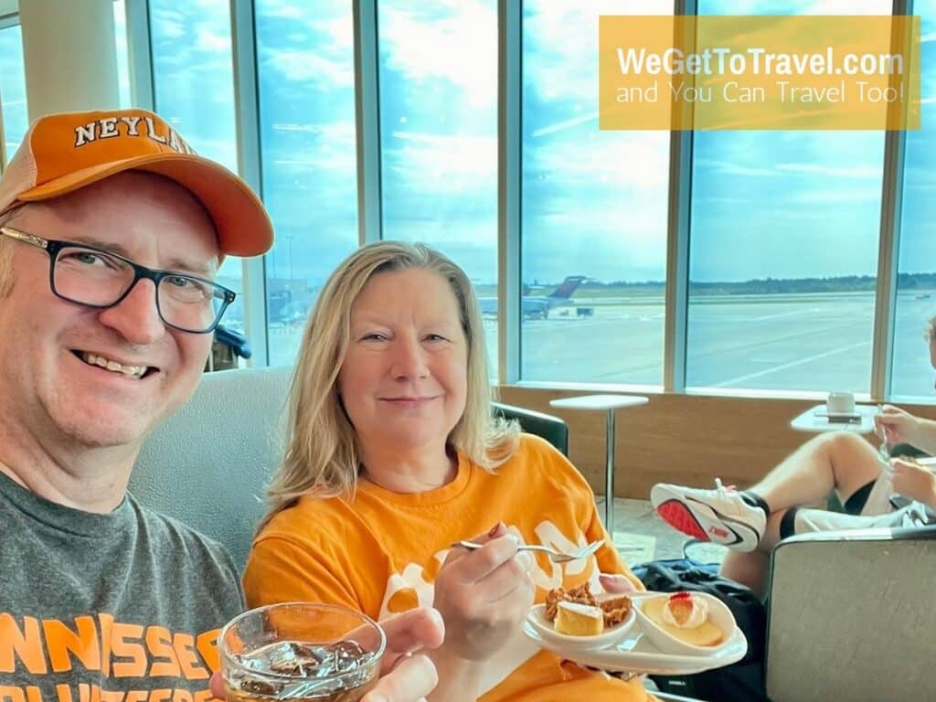 Ross and Sandra enjoying free food and drinks in Club CLT Lounge at Charlotte airport