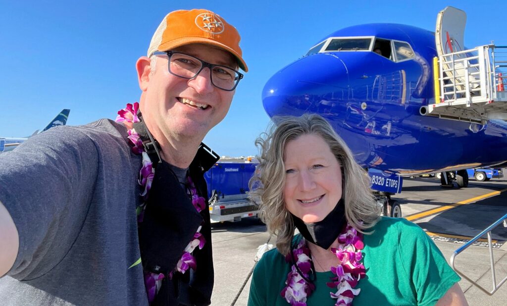 Zuzu and Ross in front of Southwest Airplane thanks to Companion Pass Free Flights