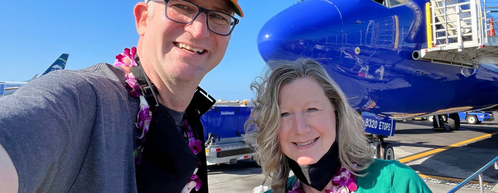 Zuzu and Ross in front of Southwest Airplane thanks to Companion Pass Free Flights