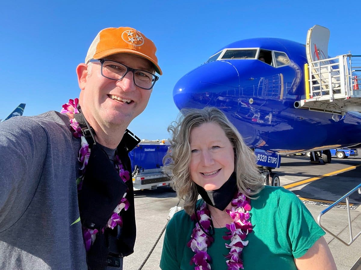 Ross & Sandra in front of Southwest airplane on tarmac in Hawaii