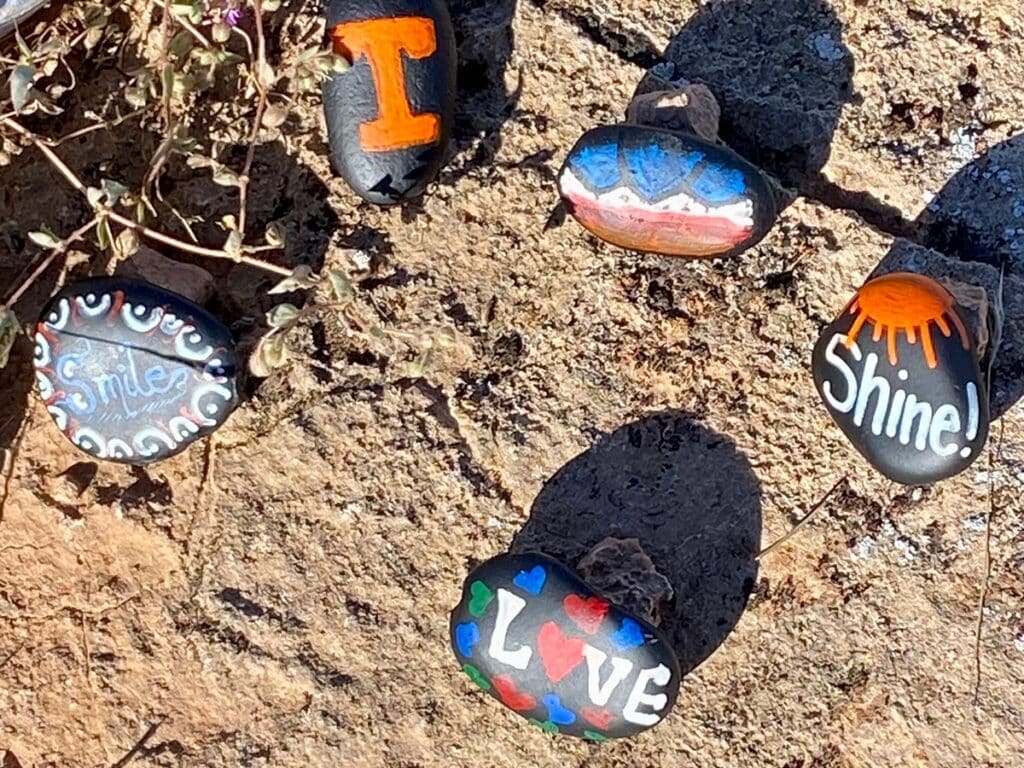 Aspiration Trail rocks painted with "Smile," "Love, "Shine," and a Power T for Tennessee