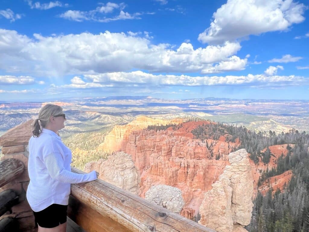 Zuzu viewing the red and white rock formations from the top of Bryce Canyon National Park.