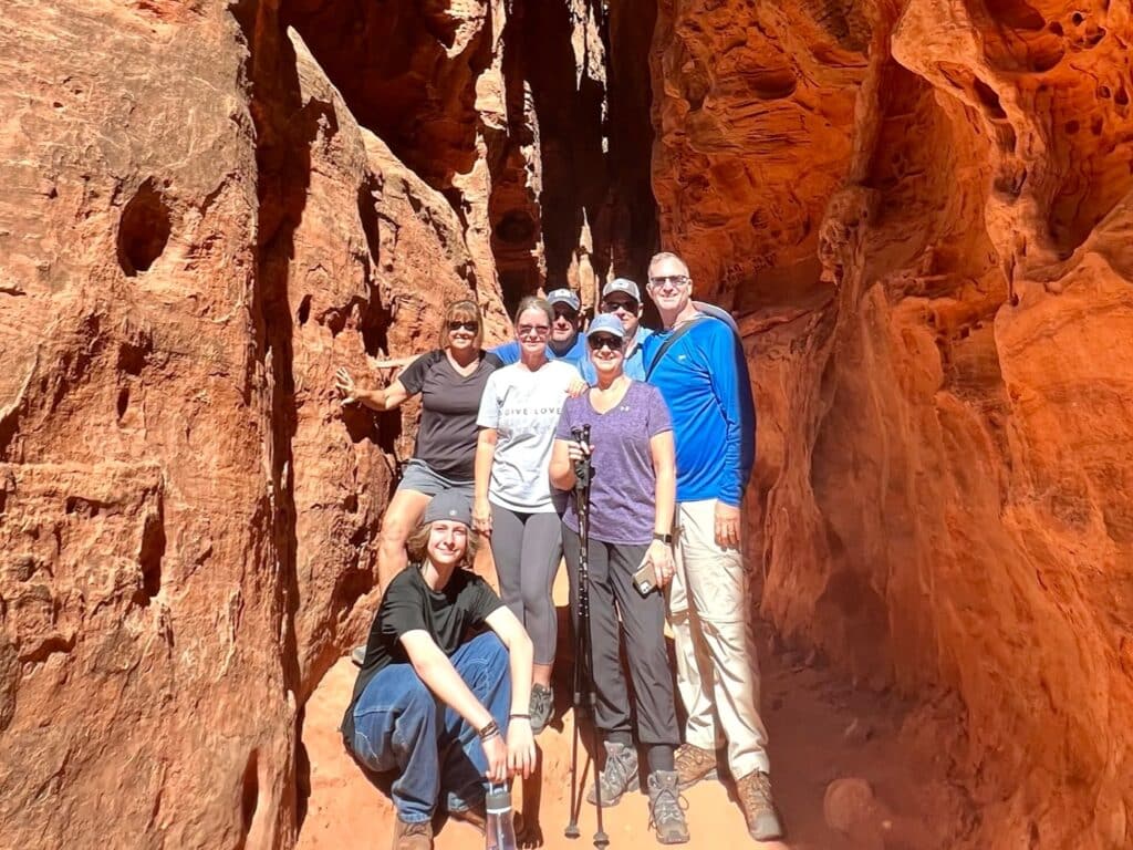 7 hikers in a box canyon in Snow Canyon State Park
