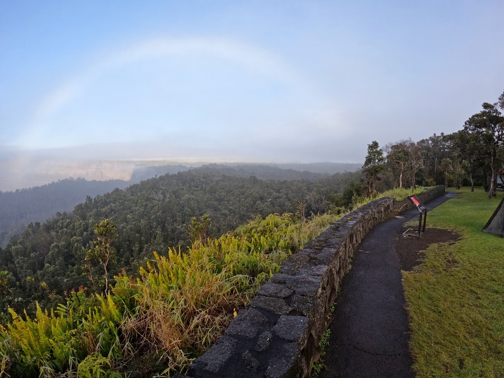 rainbow stretching into the crater at Kilauea Volcano