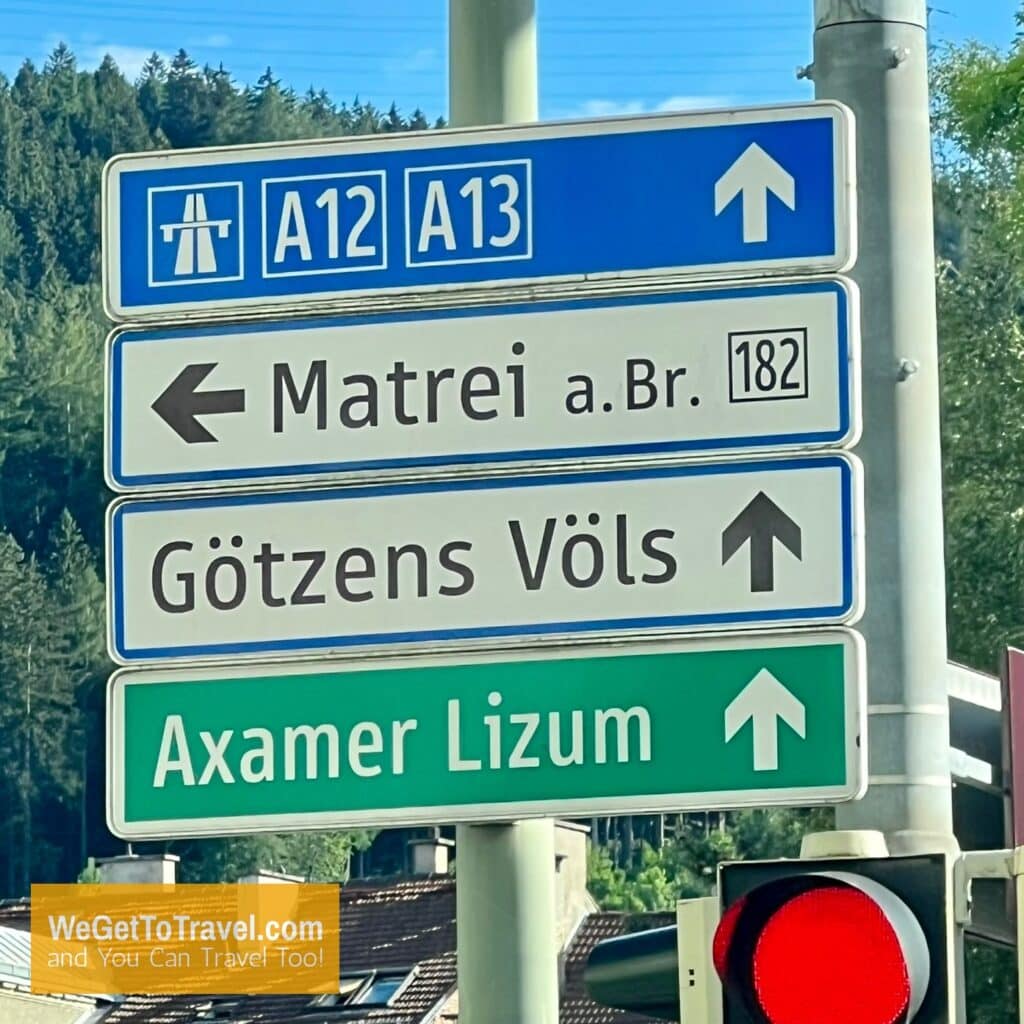 Road sign in Austria pointing towards Gotzens Völs