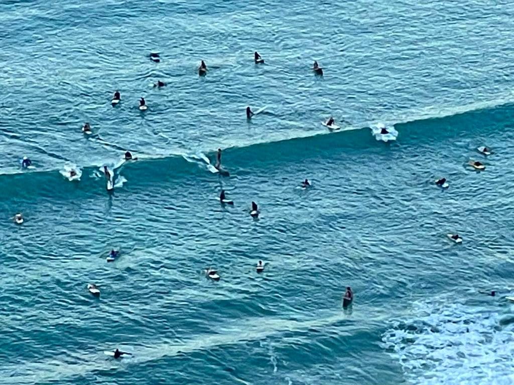 surfers in the water at Waikiki Beach