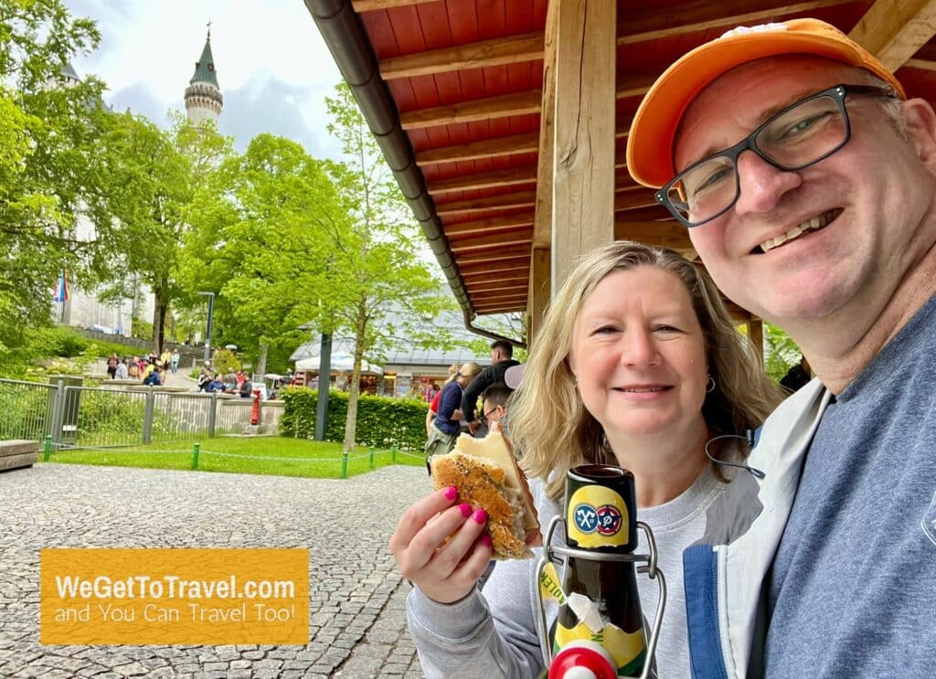 Ross and Sandra sharing beer and sandwich at Neuschwanstein Castle