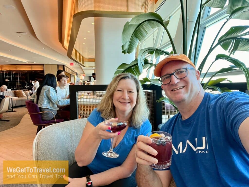 Ross and Zuzu enjoy drinks for free at the Chase Sapphire Lounge at JFK airport